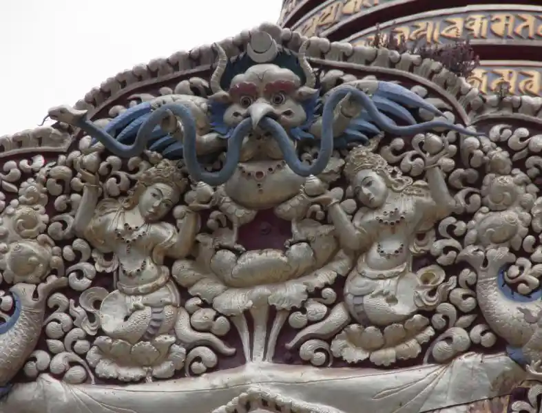 Circle on a crescent on top of a horned bird-like creature with a snake on its beak, Swayambhu Buddha Park